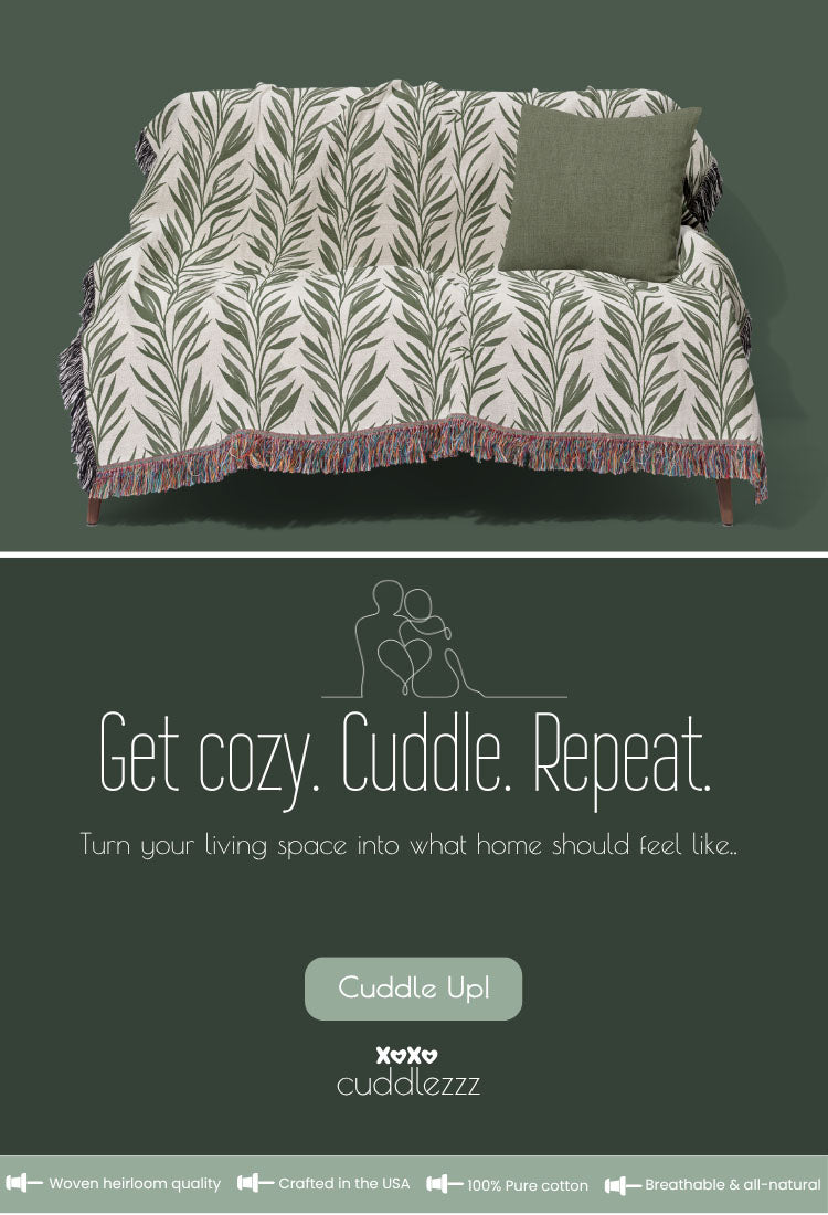 CUDDLEZZZ mobile homepage banner showing a green woven blanket with leaf pattern, matching pillow, and the text 'Get cozy. Cuddle. Repeat.' promoting cozy living essentials.
